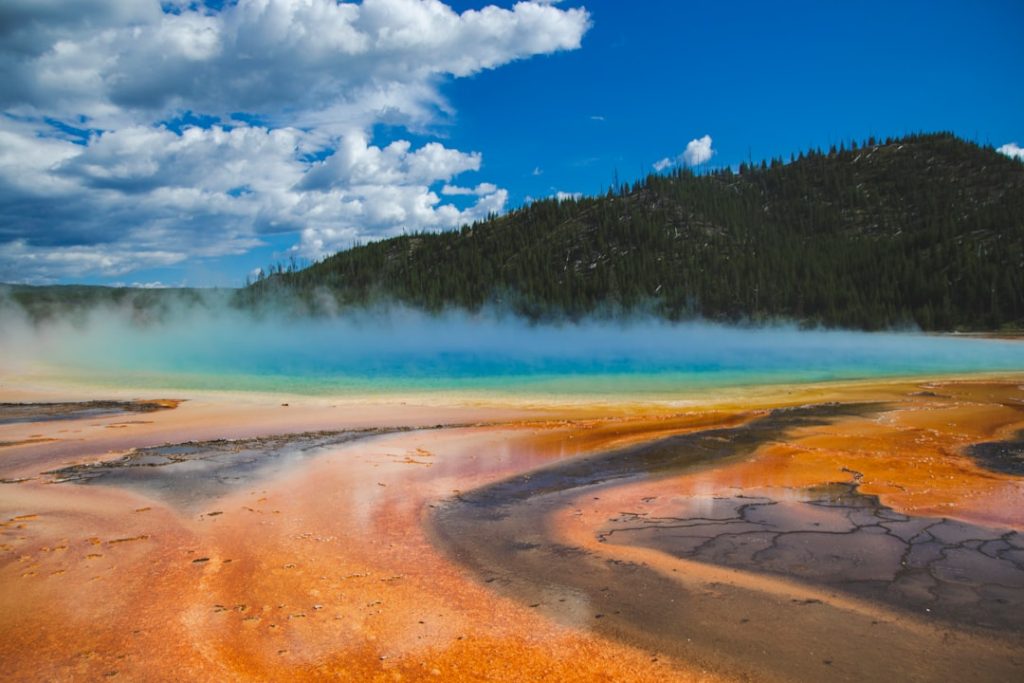 Grand prismatic spring in Yellowstone national park, United States of America. Memory card from vacation, travel background, Wyoming nature landscape, colorful geyser. World famous landmarks.